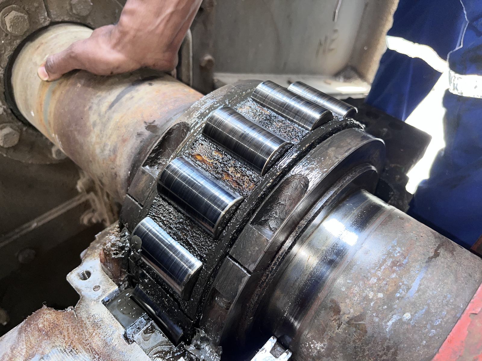 Close inspection of a worn roller bearing during a VibroCon condition monitoring visit